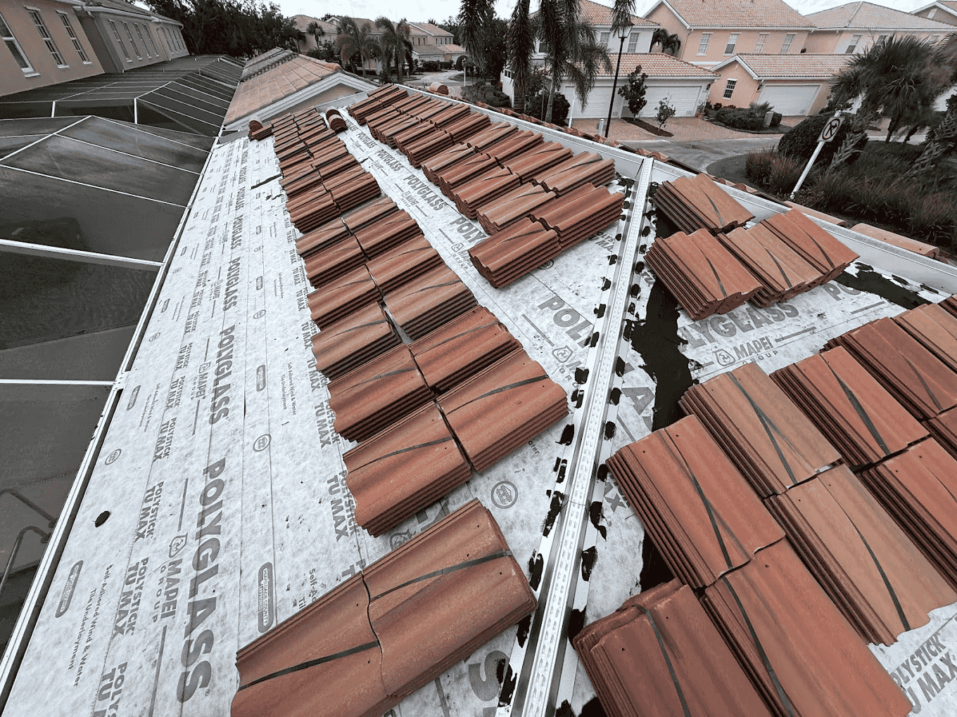 Roofer repairing storm-damaged roof in Bradenton FL