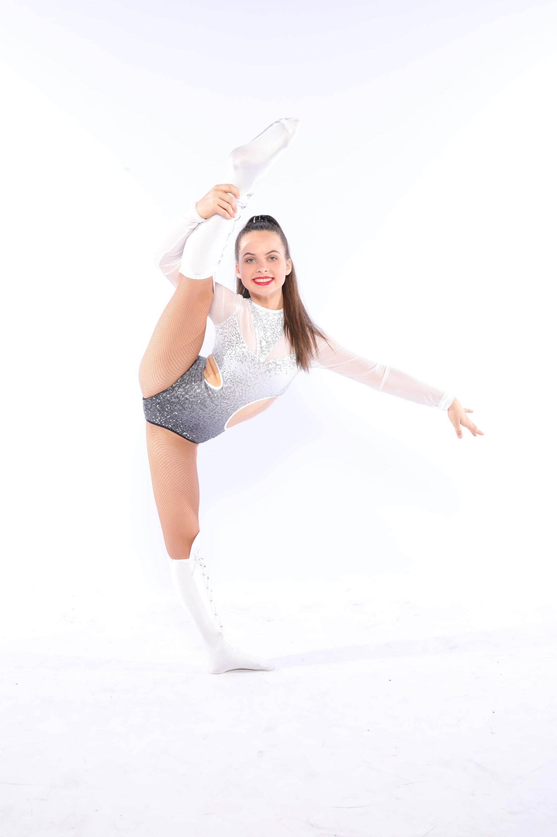 A Young Girl is Doing a Split on a White Background — Studi-O Dance School In Gateshead, NSW