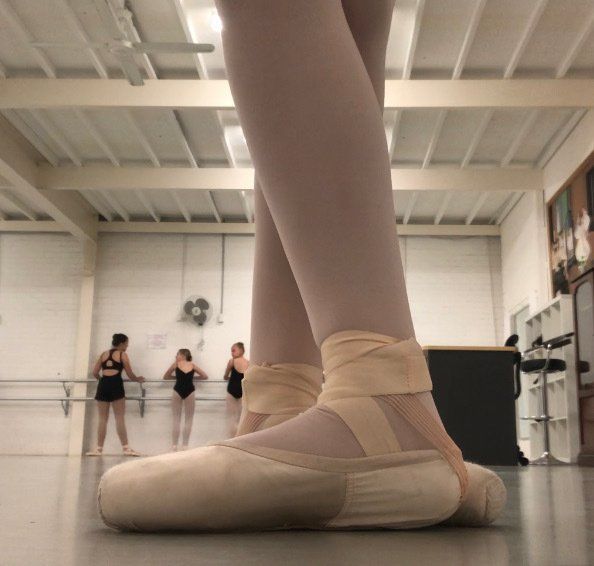 A person wearing pointe shoes in a dance studio — Studi-O Dance School In Gateshead, NSW