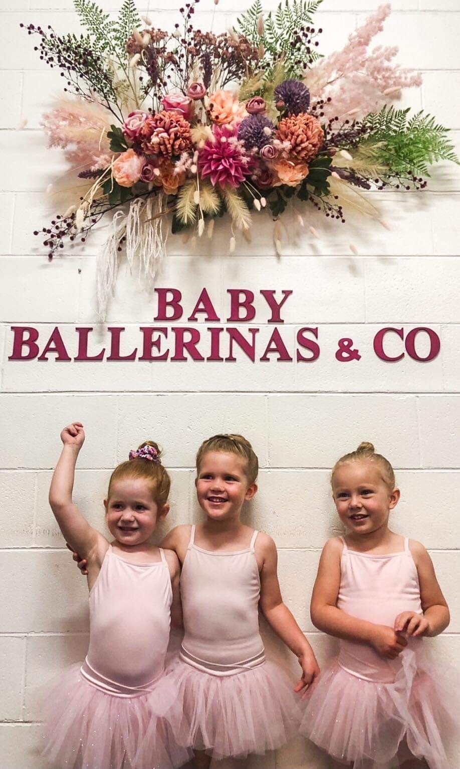 Three Little Girls in Pink Tutus Are Standing Next to Each Other — Studi-O Dance School In Gateshead, NSW