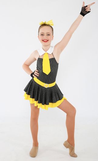 A Young Girl is Wearing a Black and Yellow Dress and Tie — Studi-O Dance School In Gateshead, NSW
