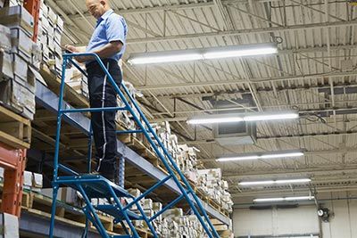 Personnel Above the Rolling Ladder — Miami, FL — Naveles Industrial Sales