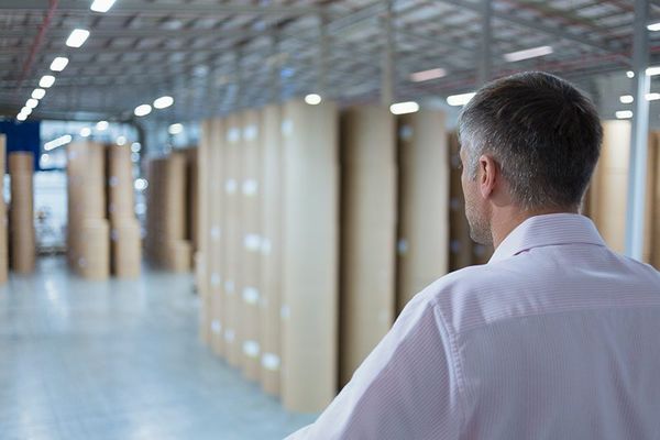 Man Looking at the Brown Shelves — Miami, FL — Naveles Industrial Sales