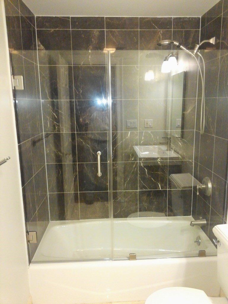 A bathroom with a bathtub and a toilet