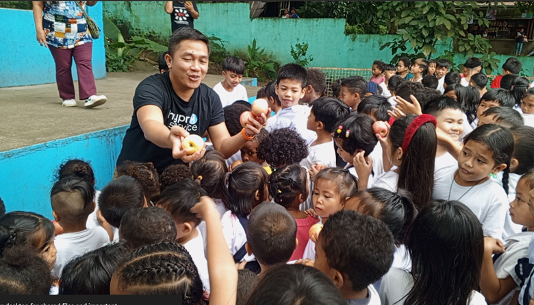 Person's hand touching connected silhouettes, representing networking or collaboration.