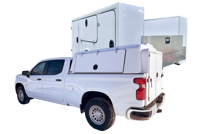 White pickup truck with a white utility topper and additional utility boxes.