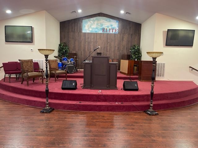 A church with a podium and a red carpet