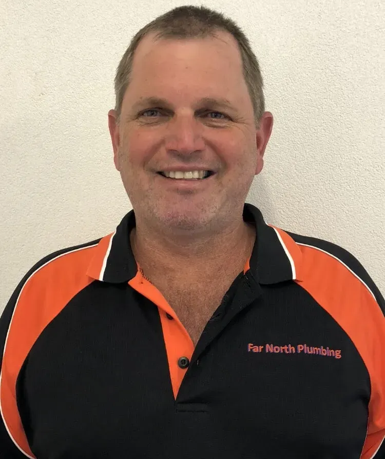 Man Wearing a Black and Orange Polo Shirt — Far North Plumbing in Mourilyan, QLD