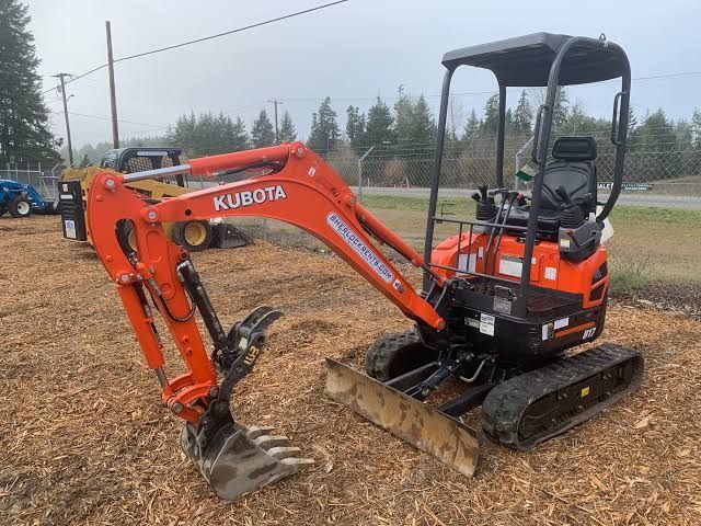 Orange Kubota Mini Excavator on a Gravel Lot — Far North Plumbing in Mourilyan, QLD