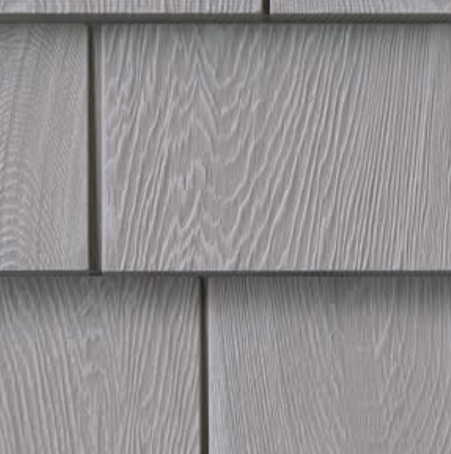 Gray wood shake siding with visible grain detail.