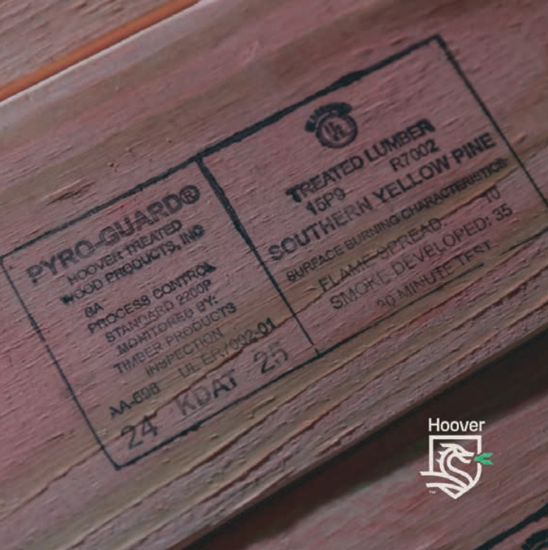 Close-up of treated Southern Yellow Pine lumber with Pyro-Guard stamp, labels, and Hoover logo.