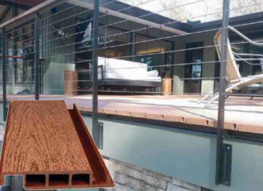Composite deck with wood-grain texture and a cable railing on a porch overlooking a seating area.