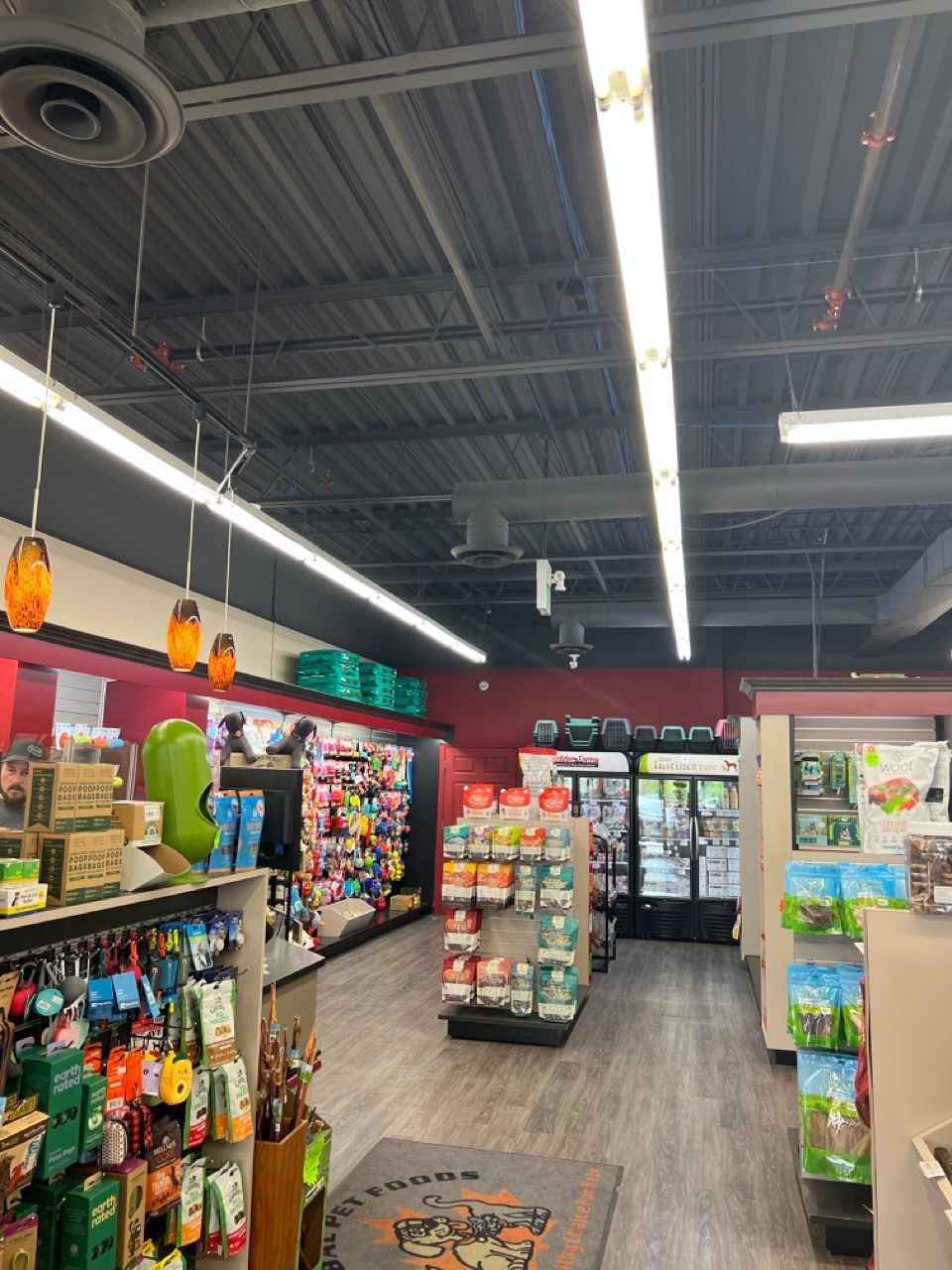 A store filled with lots of products and a refrigerator.