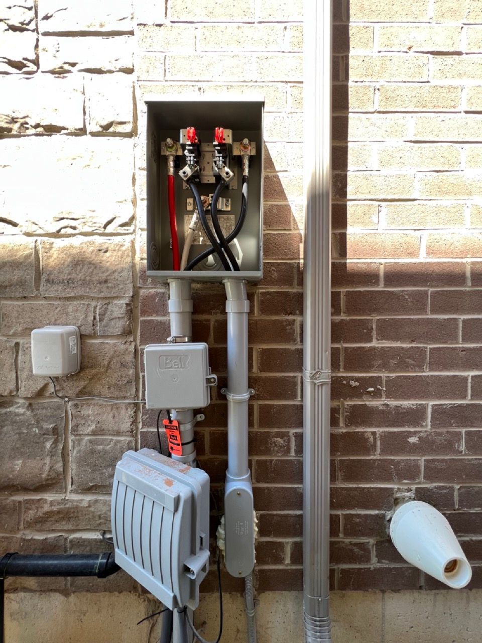 A brick wall with a box that says ' utility ' on it