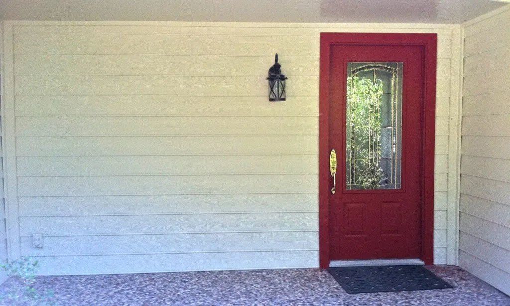 Hardie siding and fresh coat of red paint for the front door
