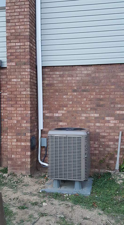 Brick Wall and Gray Air Condition Outside — Cumberland, MD — Growden Heating And Cooling