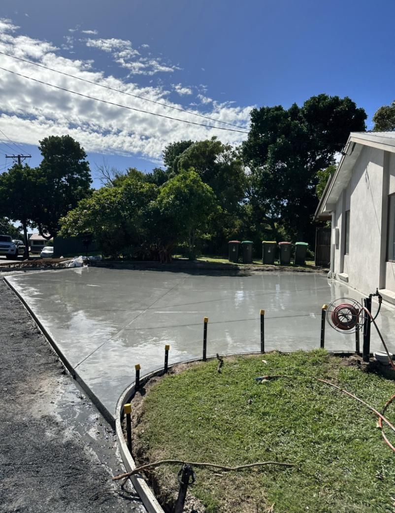 A Concrete Driveway Is Being Built In Front Of A House — Hinterland Concreting Pty Ltd In Lennox Head, NSW