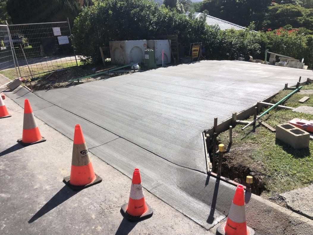 A Row Of Orange And White Traffic Cones — Hinterland Concreting Pty Ltd In Lennox Head, NSW