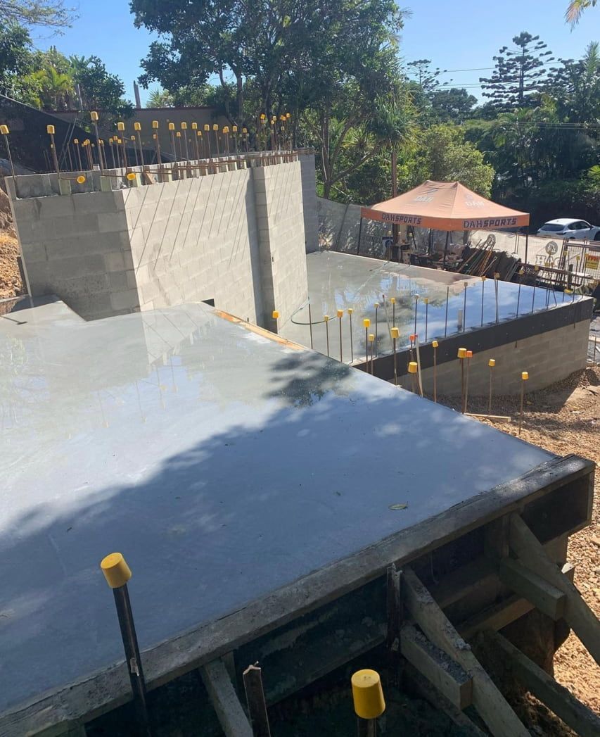 A Large Concrete Slab Is Sitting On Top Of A Construction Site — Hinterland Concreting Pty Ltd In Lennox Head, NSW