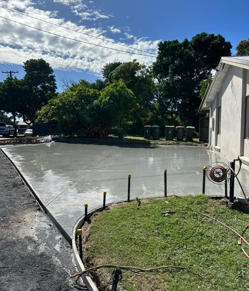 A Concrete Driveway Is Being Built In Front Of A House — Hinterland Concreting Pty Ltd In Lennox Head, NSW
