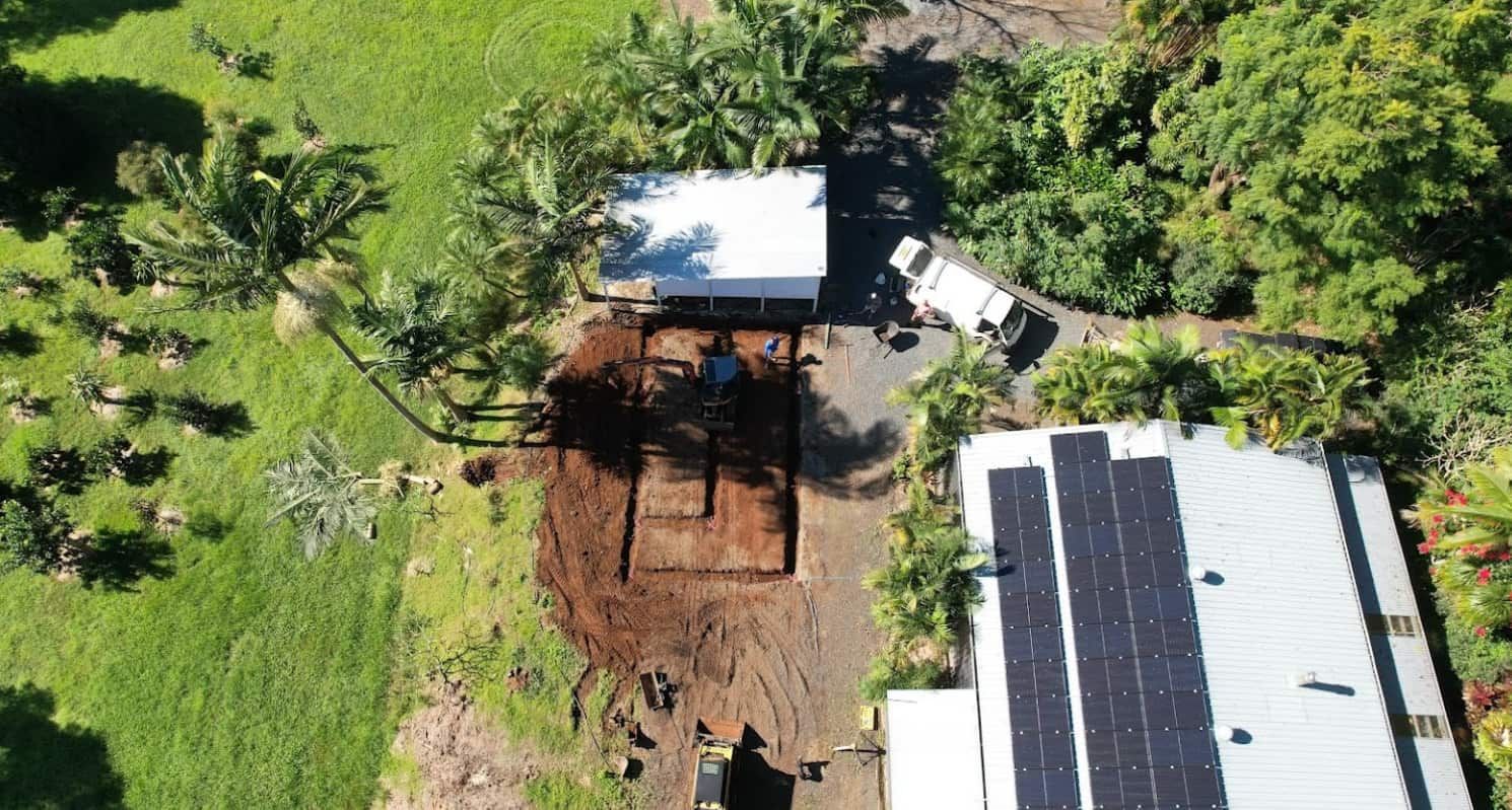 An Aerial View Of A House With Solar Panels On The Roof — Hinterland Concreting Pty Ltd In Lennox Head, NSW