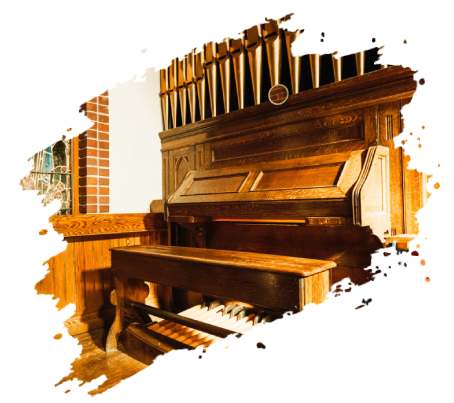 Wooden church organ with visible pipes and keys.