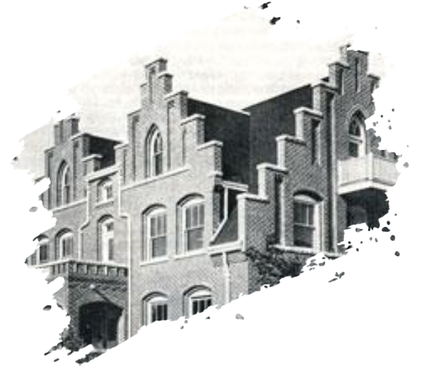 Dutch-style brick building with stepped gables, arched windows, and a small balcony.