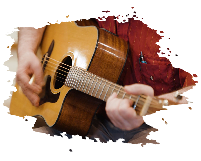 Stained glass artwork: Woman with flowing hair in prayer, another figure behind her.