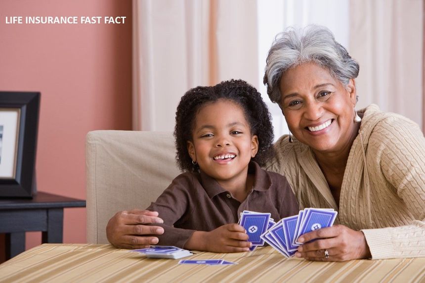 Smiling woman and child playing cards at a table in a living room, with “Life Insurance Fast Fact” text.