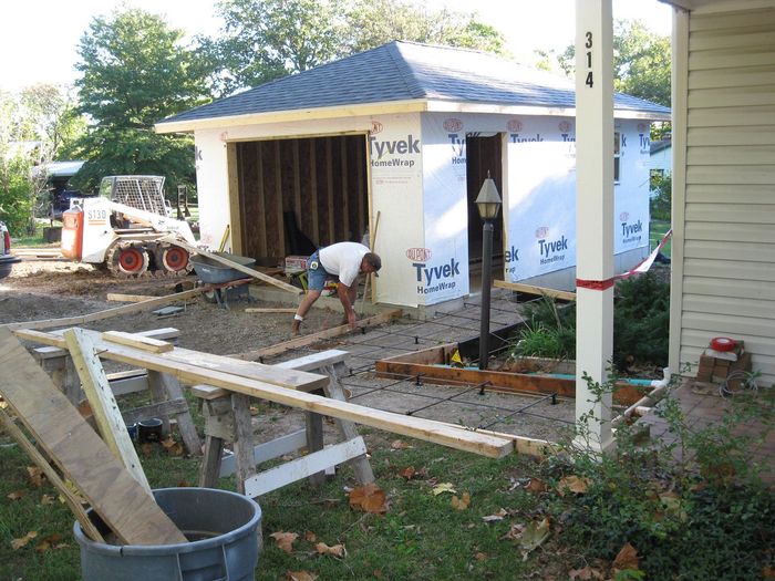 Working on A Garage that Is Being Built — Columbia, MO — Naugle Construction Company