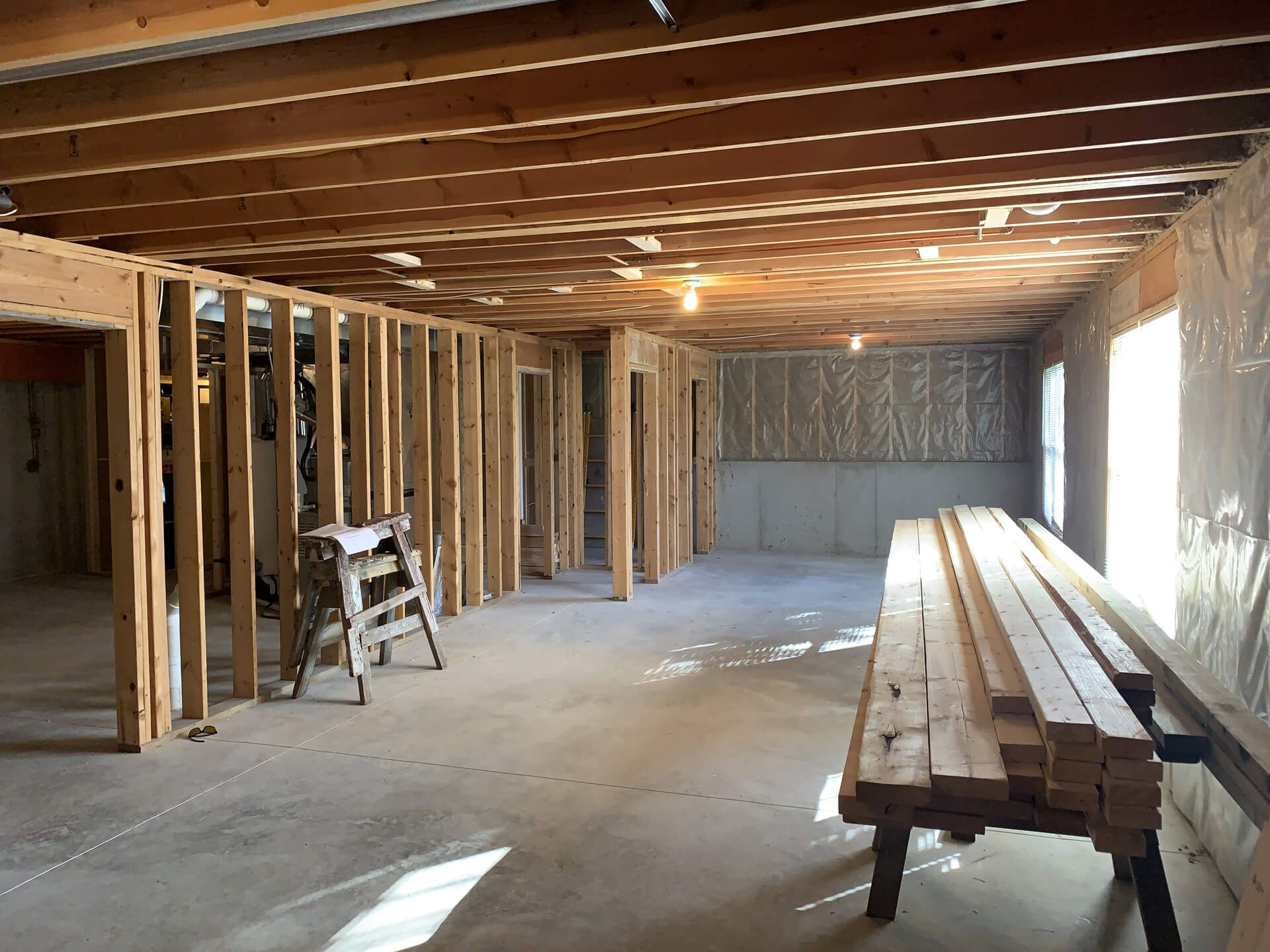 Large Room with A Lot of Wooden Beams and A Ladder — Columbia, MO — Naugle Construction Company