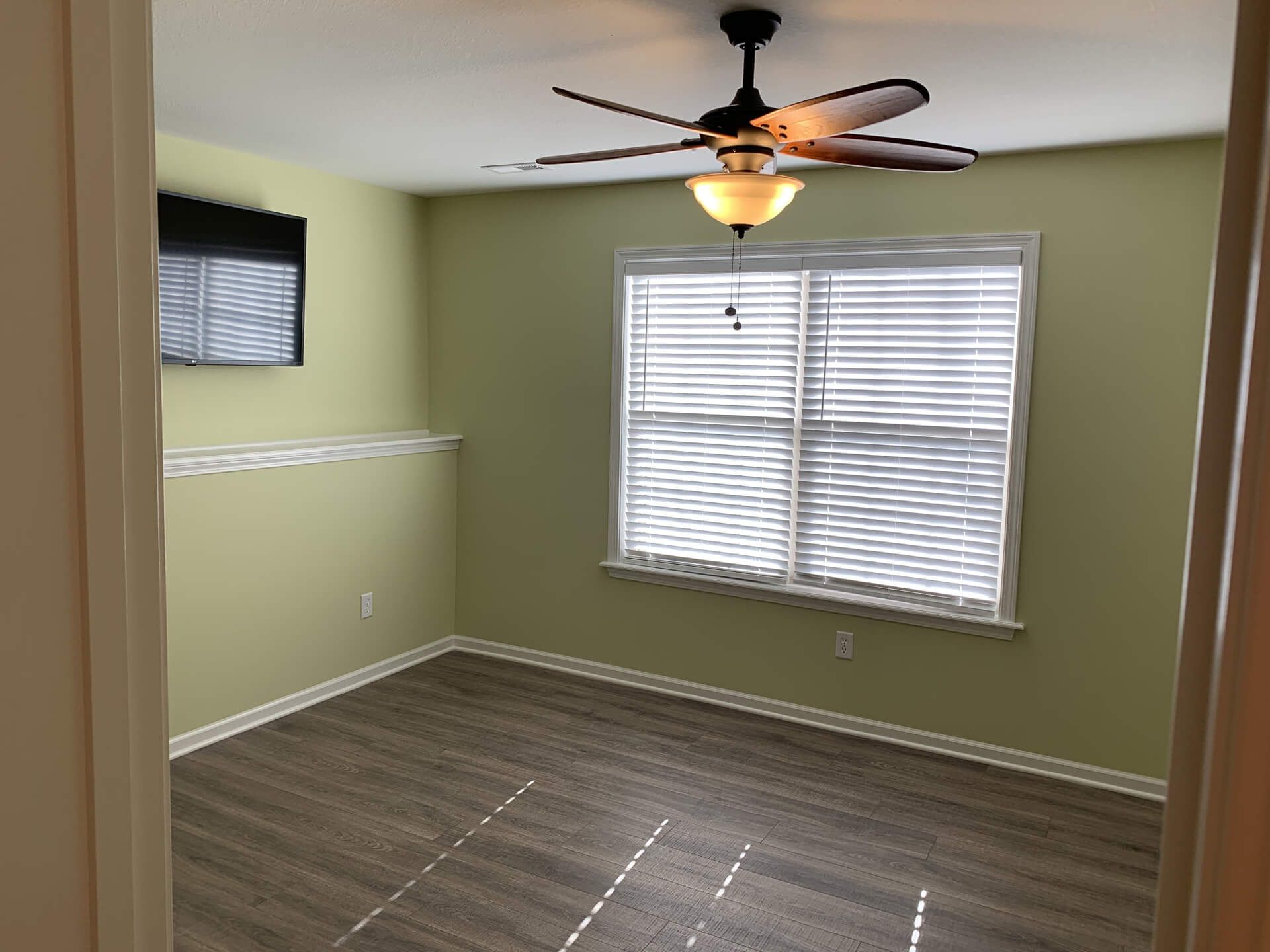 Empty Room with A Ceiling Fan and A Window — Columbia, MO — Naugle Construction Company