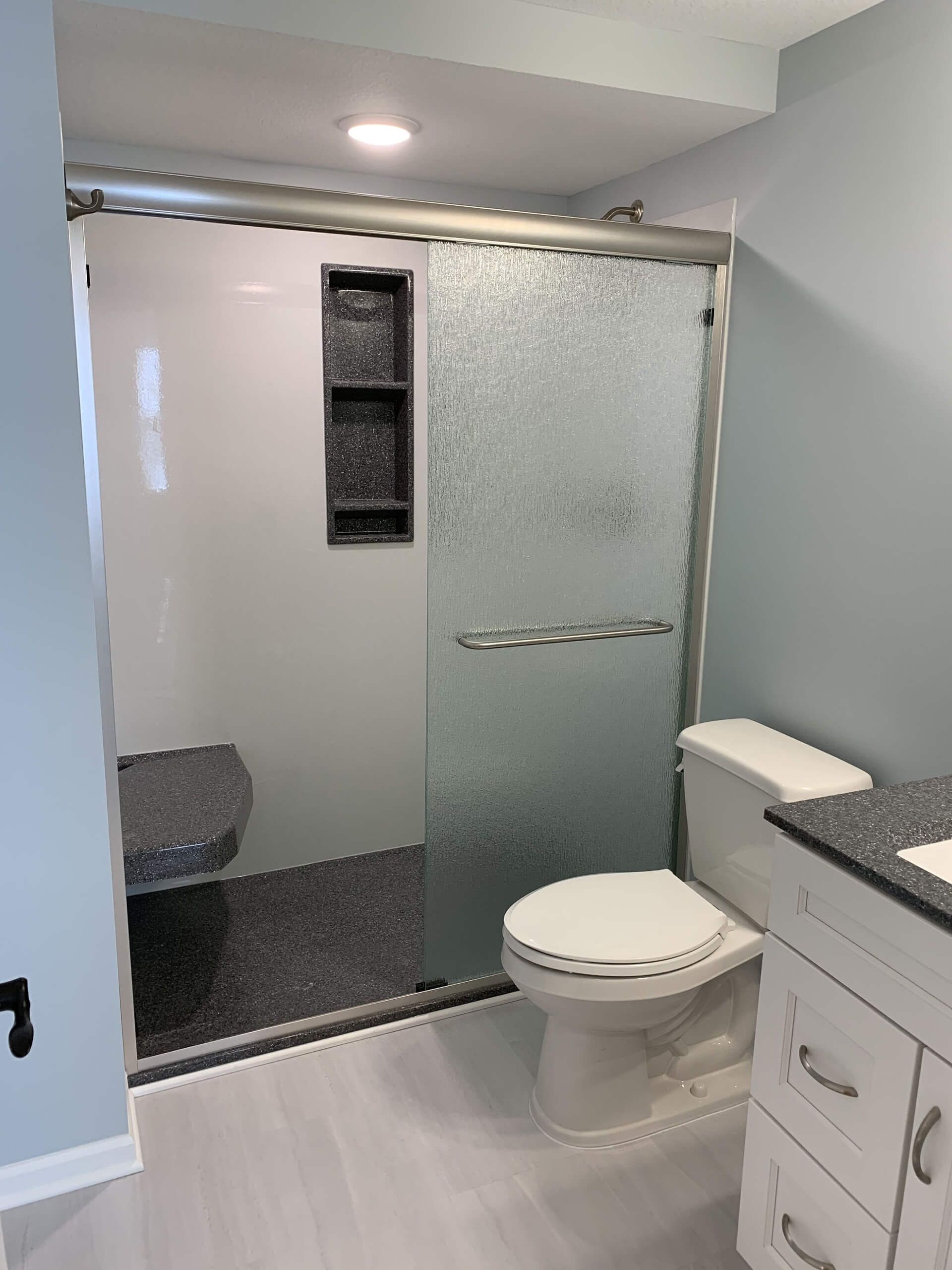 Bathroom with A Toilet, Sink, and Shower — Columbia, MO — Naugle Construction Company