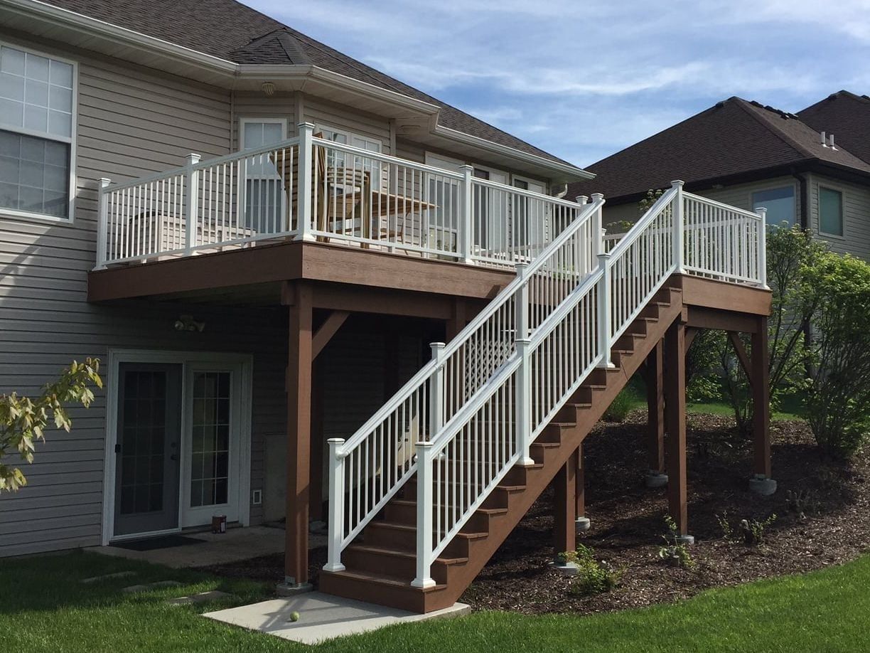 A House with A Deck and Stairs Leading up To It — Columbia, MO — Naugle Construction Company