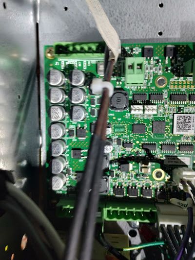 A close up of a motherboard with a barcode on it