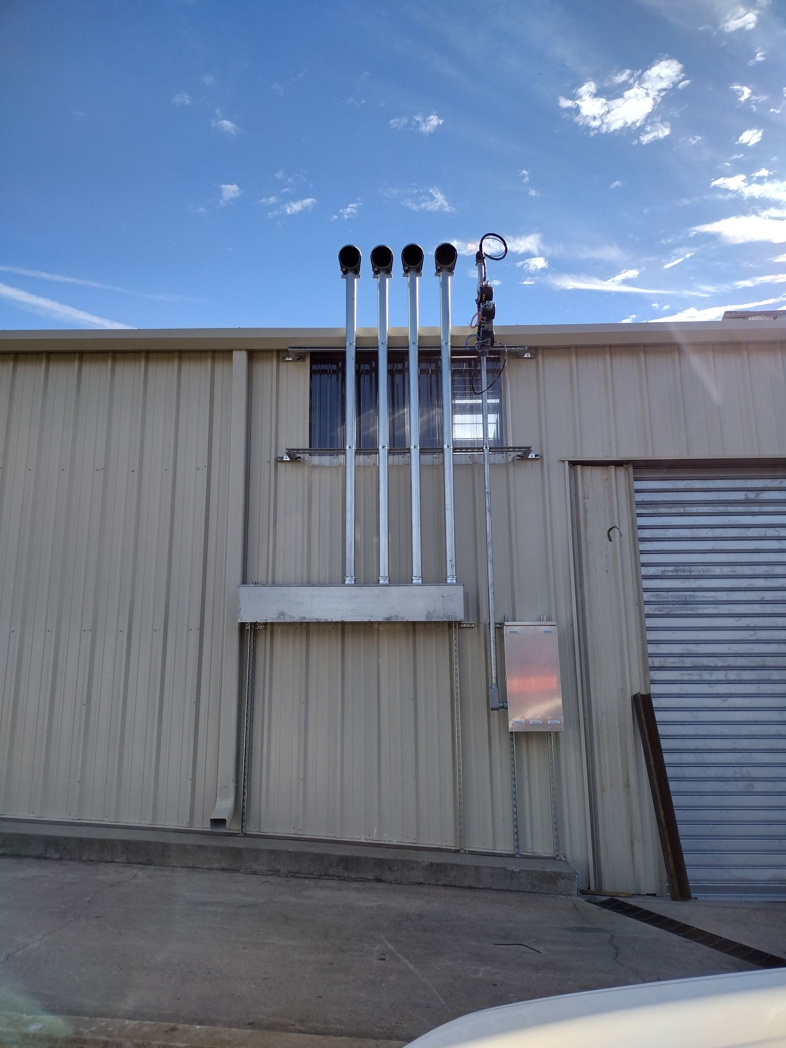 A building with a lot of pipes attached to it