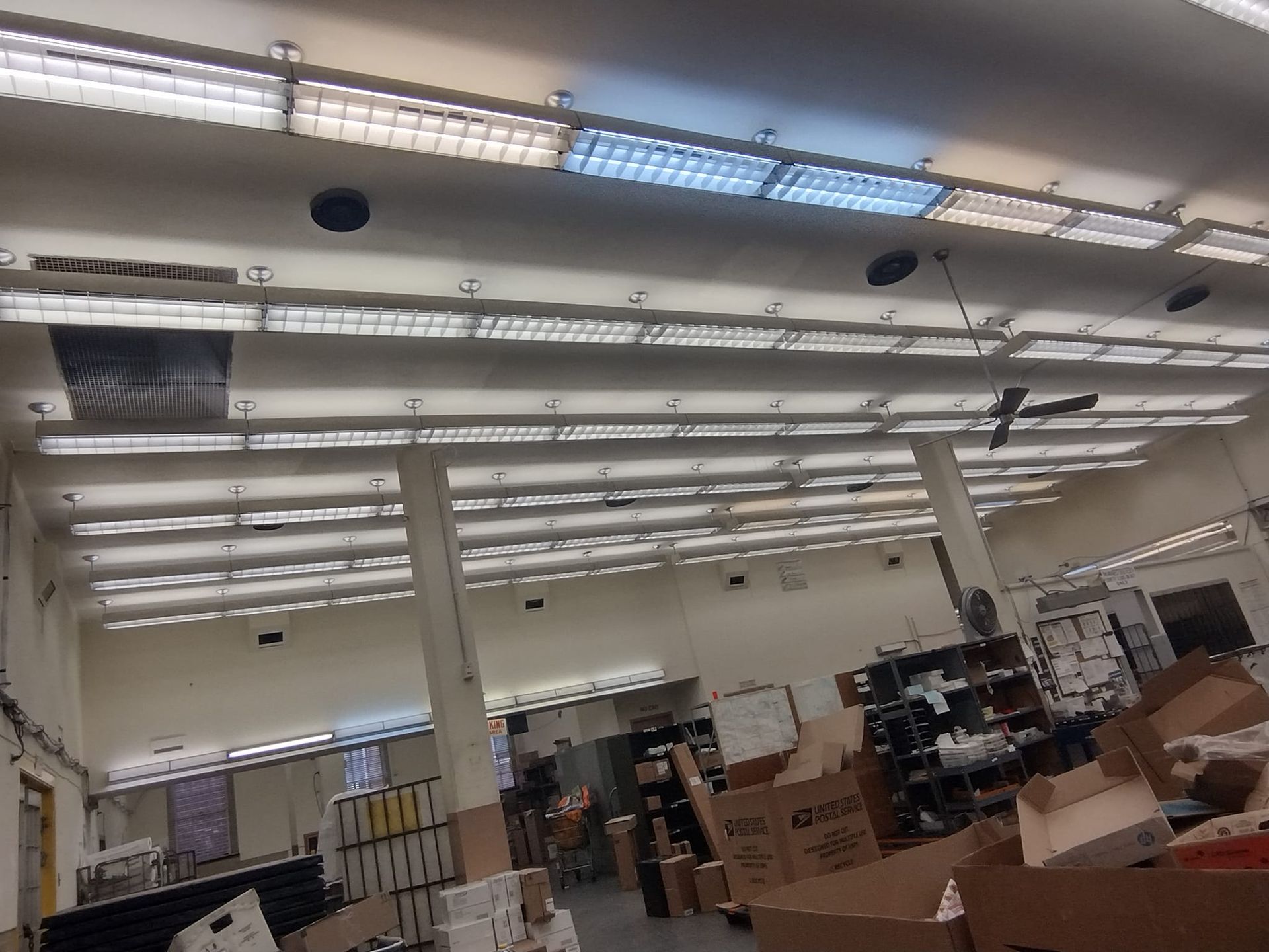 A large room with a lot of lights on the ceiling