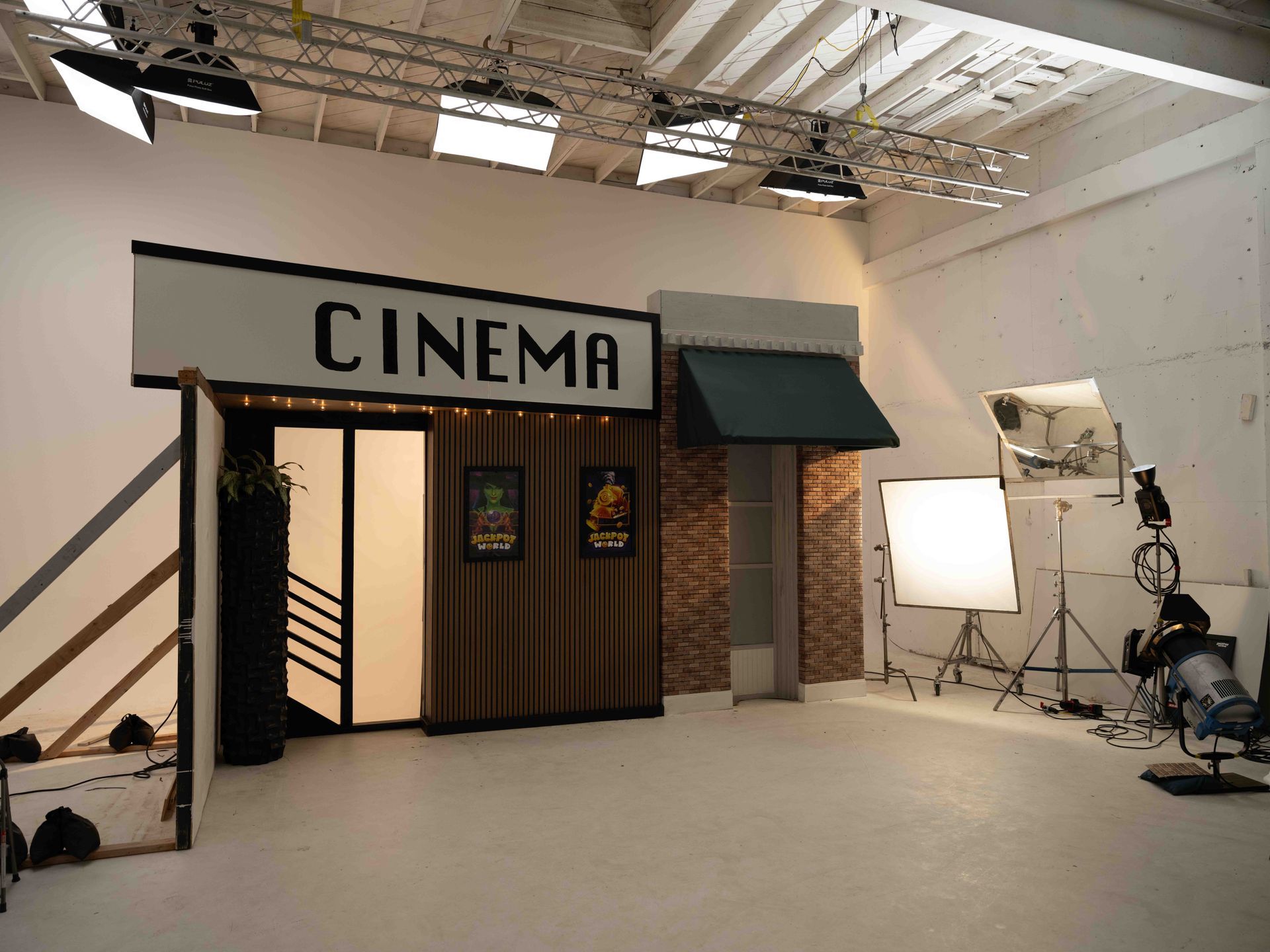 Cinema set in a studio with lights and filming equipment.
