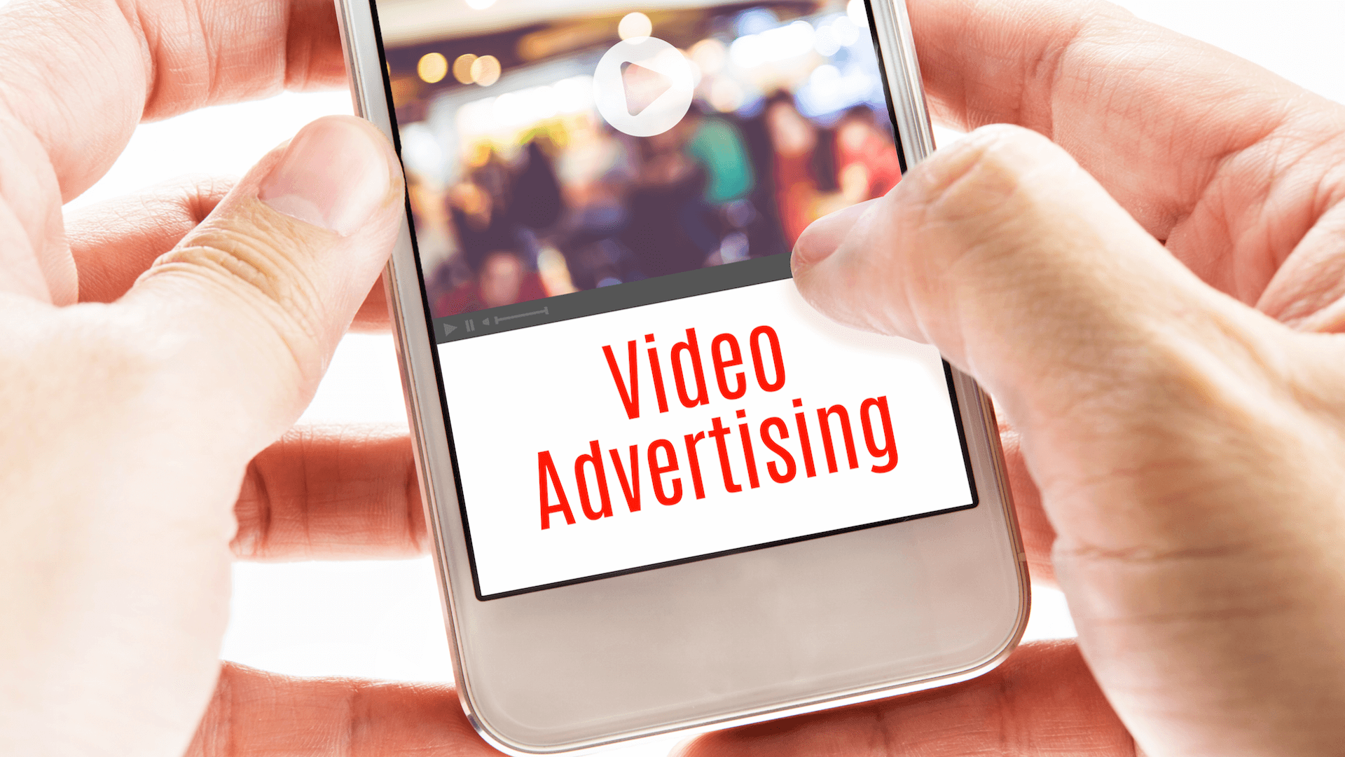 A person is holding a cell phone with the words video advertising on the screen.