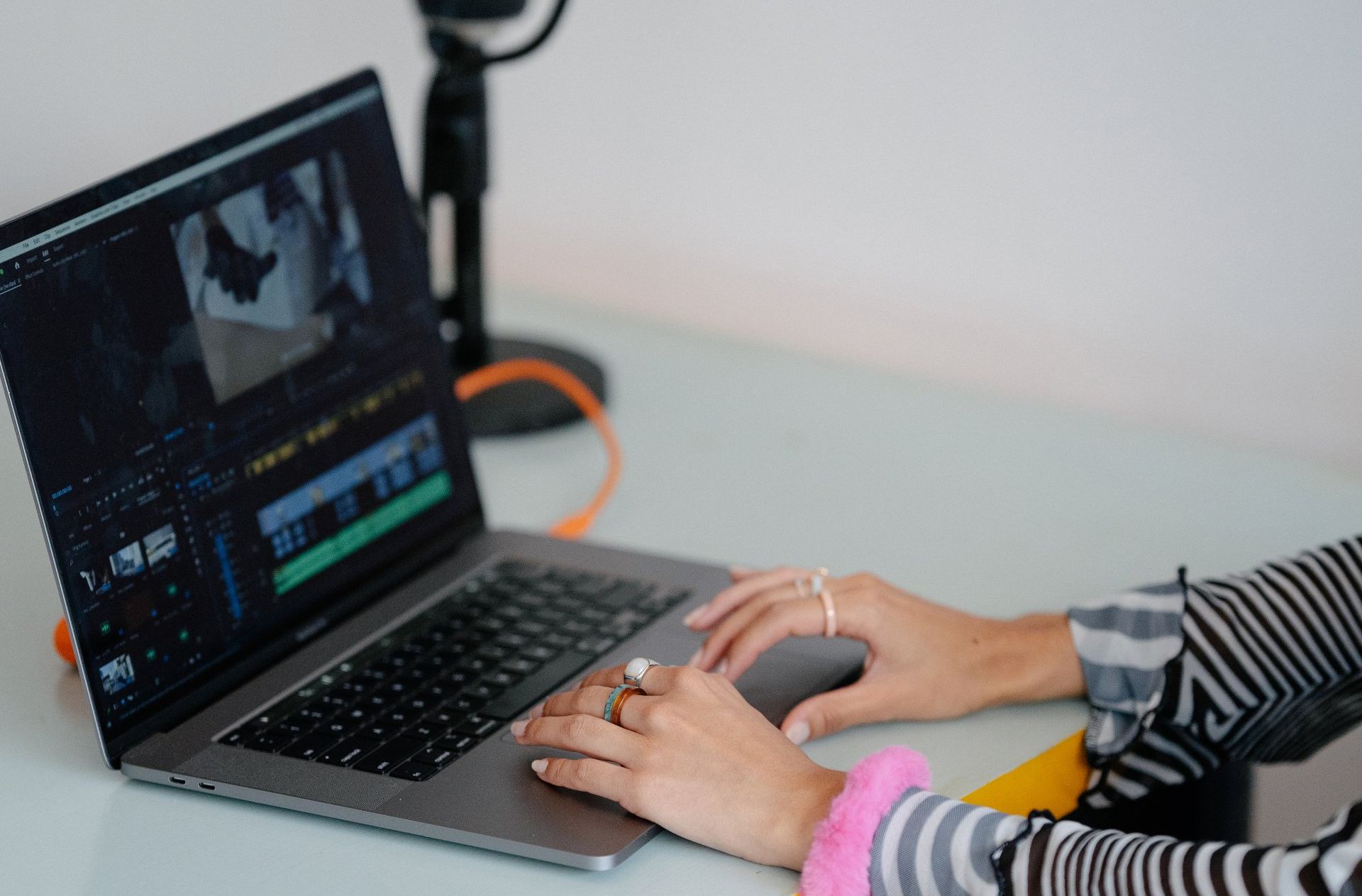 A person is using a laptop computer on a desk.