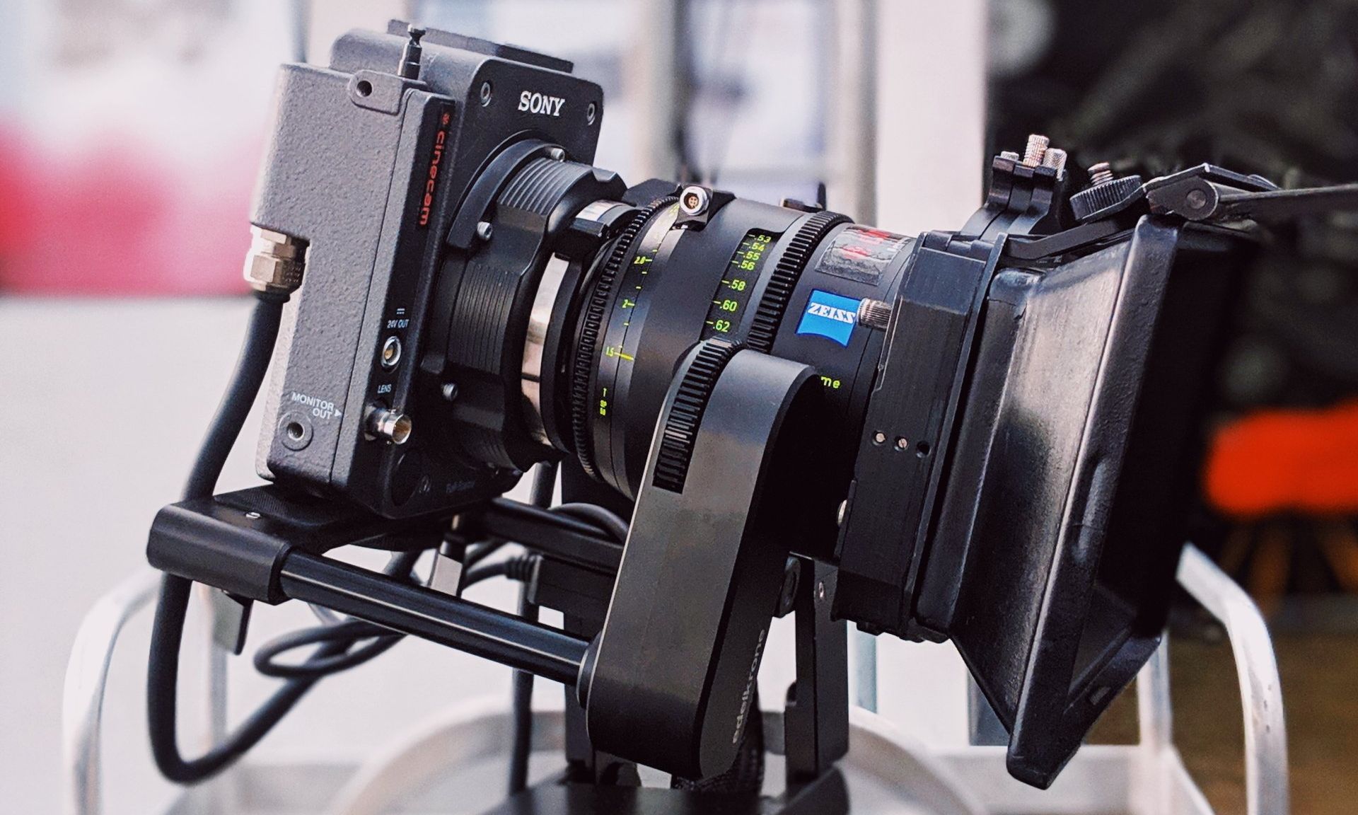 A camera with a lens attached to it is sitting on a table.