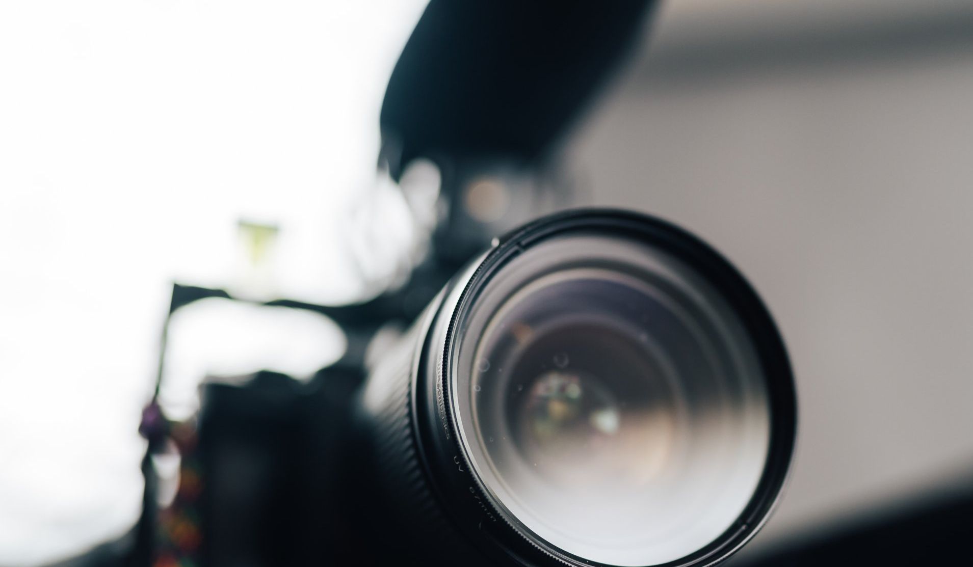 A close up of a camera lens on a table.