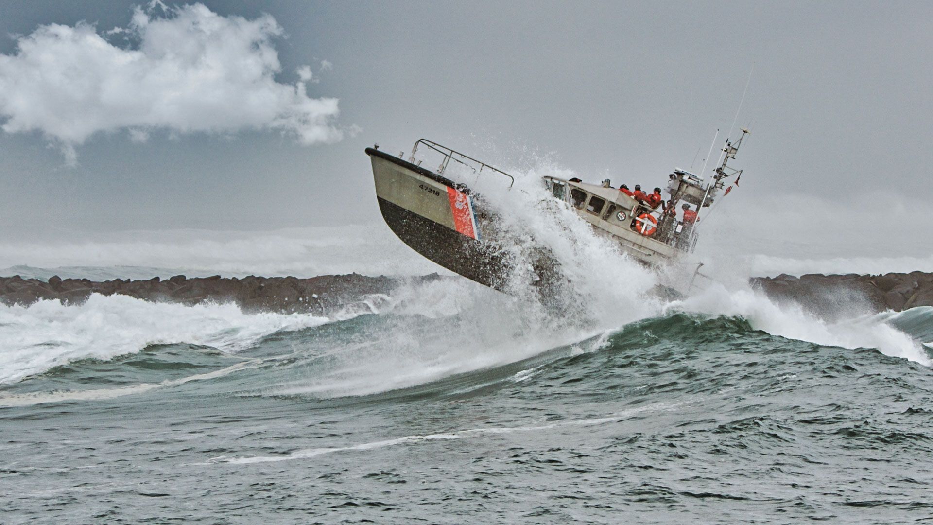 A boat is going through a wave in the ocean