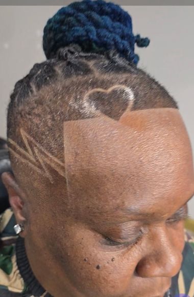 A close up of a woman 's head with a heart drawn on it.
