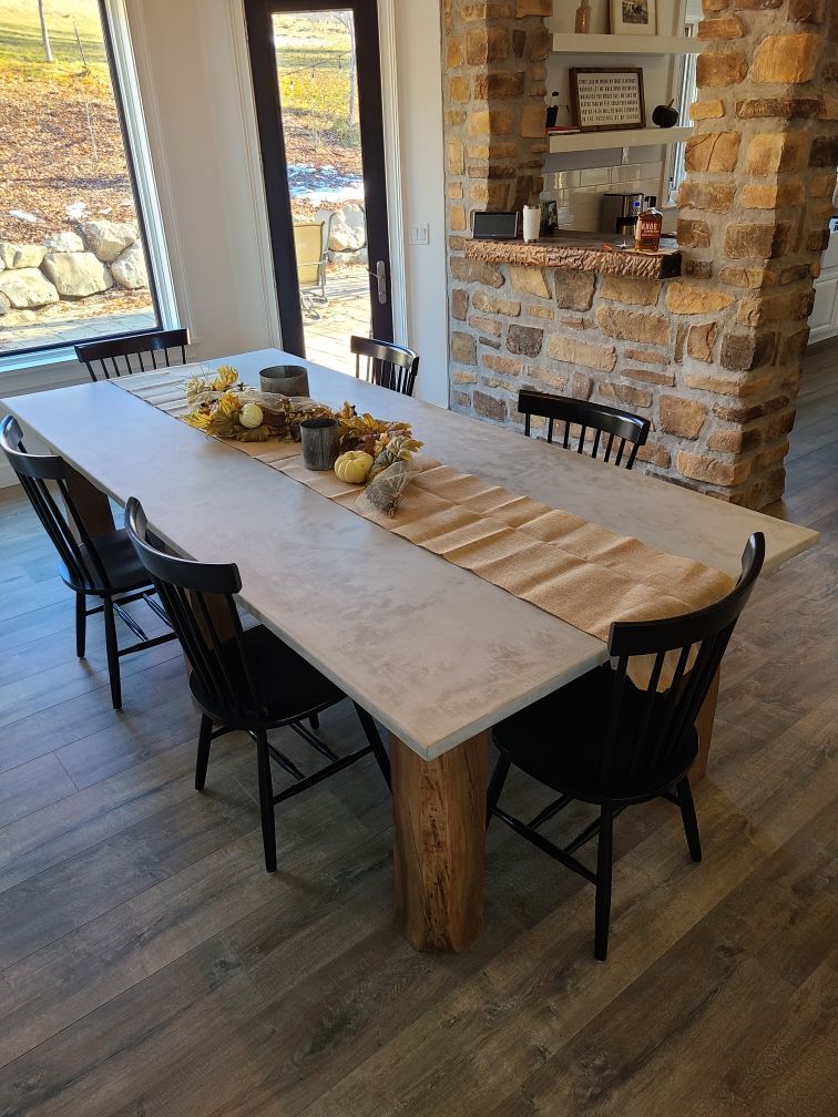 Waypoint Concrete built a rustic-style concrete dining table with integrated support in Middleton, Idaho.