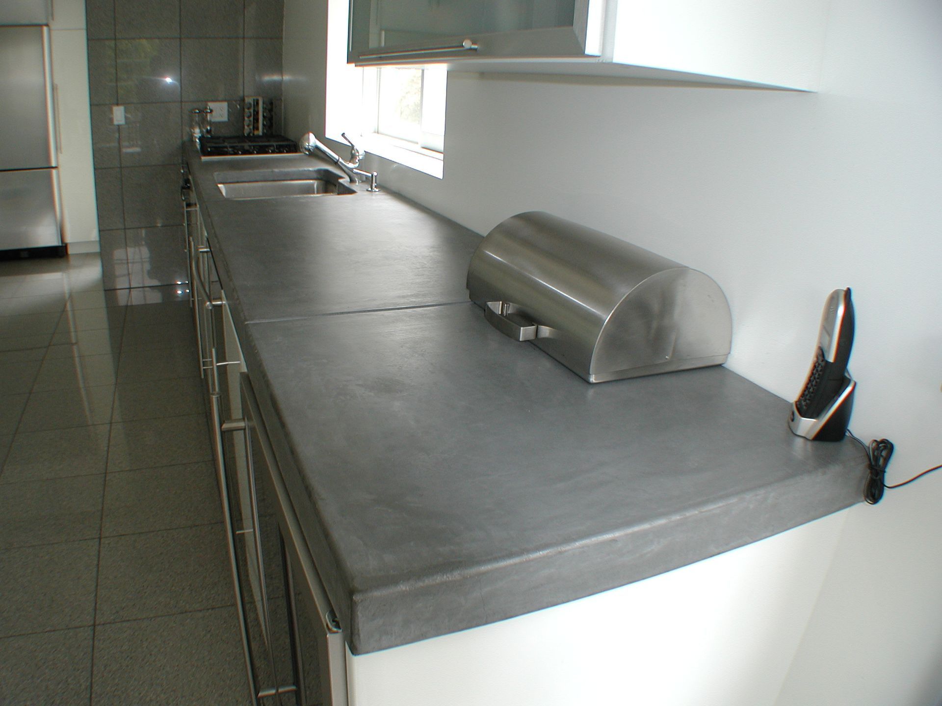 Waypoint Concrete installed a minimalist gray concrete countertop with clean edges in a home in Middleton, Idaho.