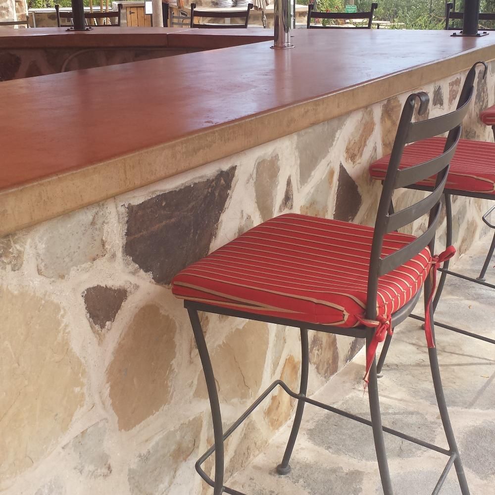 Waypoint Concrete created a red-tinted concrete counter with stone base for a bistro in Payette, Idaho.