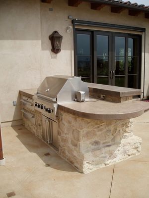Waypoint Concrete installed a curved outdoor concrete countertop with built-in grill in McCall, Idaho.