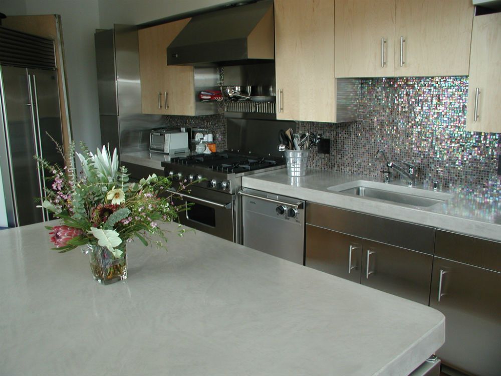 Waypoint Concrete created smooth concrete kitchen counters with modern finishes in a home in Garden City, Idaho.