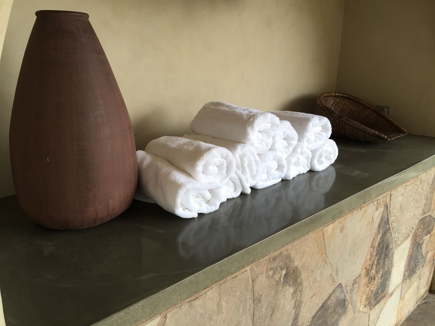 Waypoint Concrete built a custom textured concrete shelf countertop for a spa setting in McCall, Idaho.